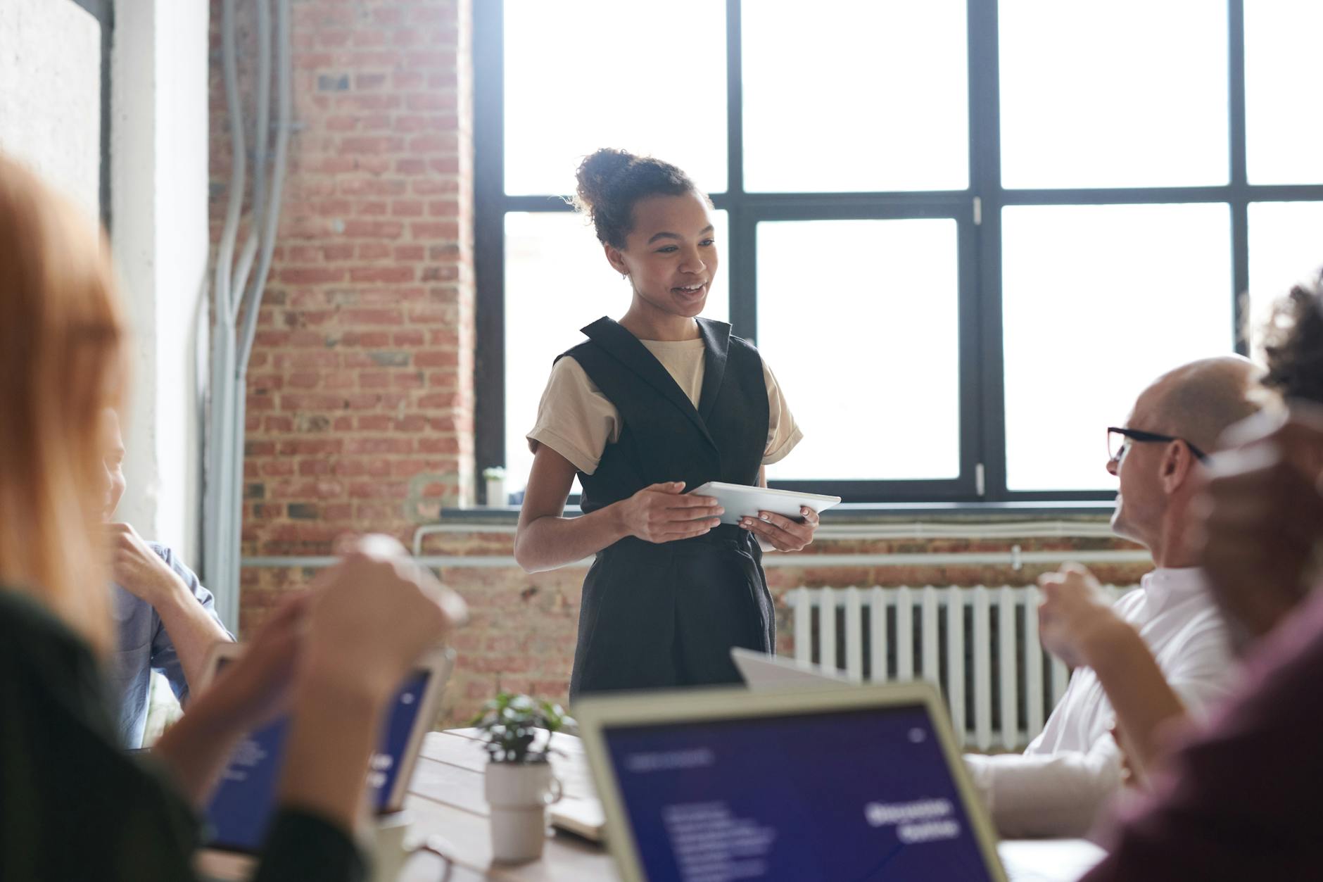 Speaker smiles and is relaxed in a presentation